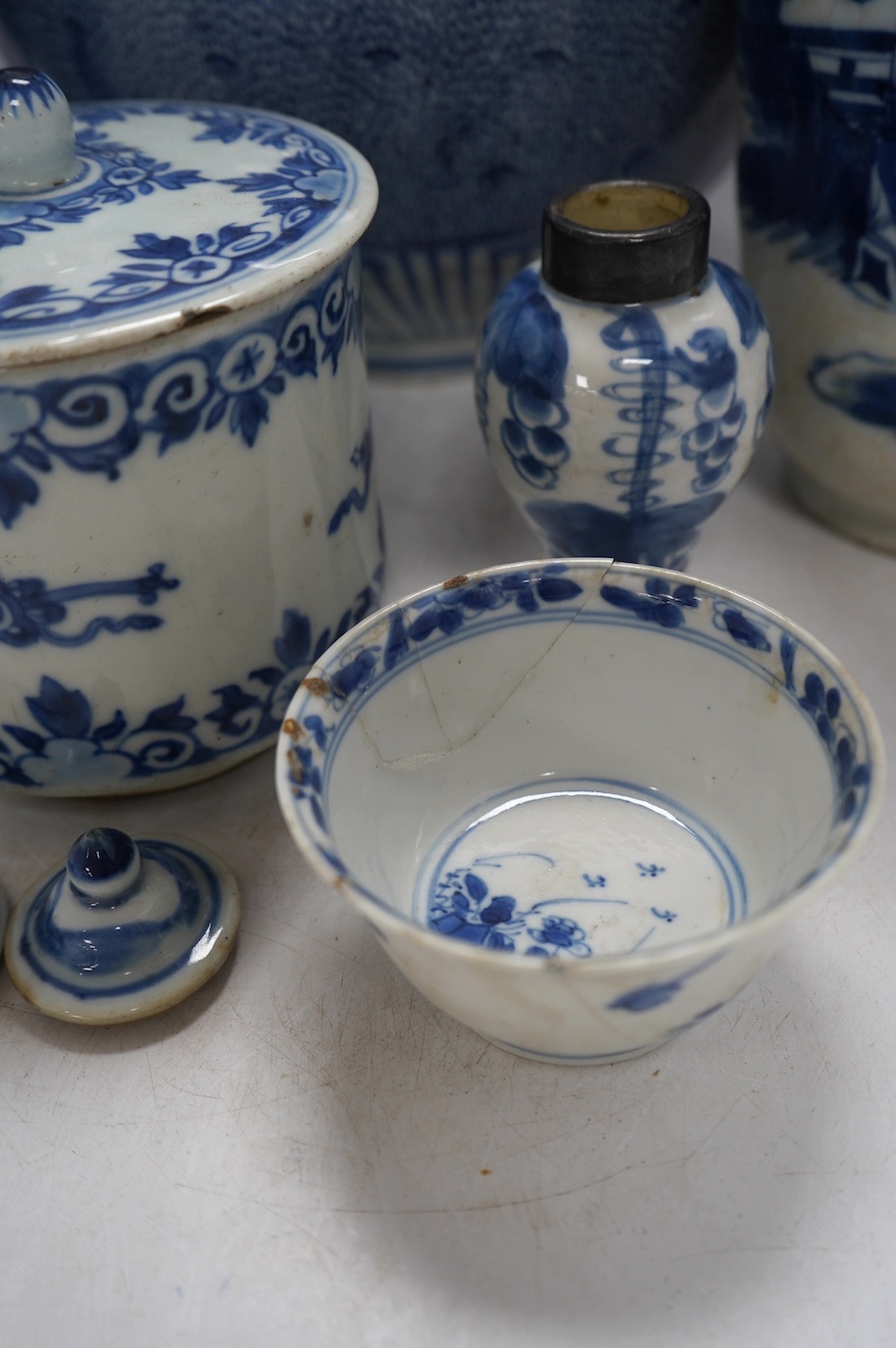 Four Chinese blue and white vases, a jar and cover and a tea bowl, Kangxi to 20th century, tallest vase 38cm high. Condition - poor